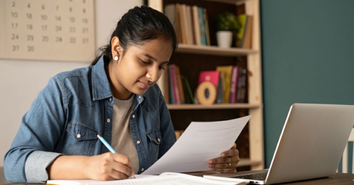 consults Australia immigration consultants in Kerala, diligently reviewing documents for her immigration process.